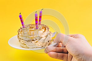 Cake with cream and three candles