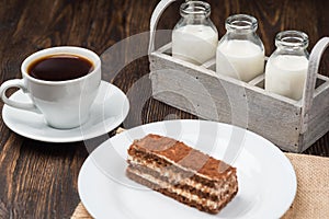 Cake and cup of coffee on a wooden table