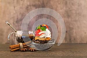 Cake and a cup of tea on a table decorated with cinnamon grains