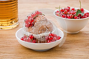 Cake is decorated with berries and red currant in a white plate/cake is decorated with berries and red currant in a white plate.