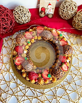 Cake decorated with dulce de leche, strawberries and brigadeiro balls. photo