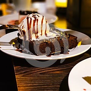 Cake Delight: Indulgent Layers of Chocolate Sauce and Ice Cream