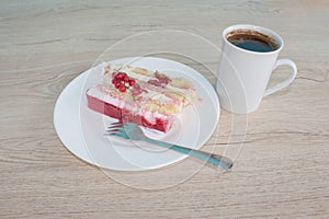 Cake on dish with currant in a relaxing time. Piece cake on white plate with fork