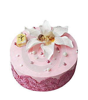 Cake with edible lace and a flower of mastic on which the baby figure lies