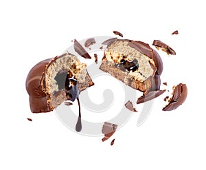 From the cake flows chocolate on white background