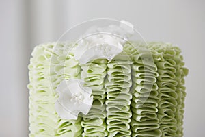 Cake with Fondant Ruffles and Sugar Flowers