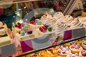 Cake with fresh berries and cream on shop window