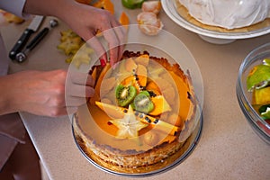 Cake with fresh fruits kiwi dragon fruit papaya mandarin carambola