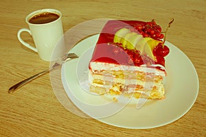 Cake with fresh red currant on the plate, closeup. Close up cake