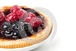 Cake with fruit and jelly on a plate