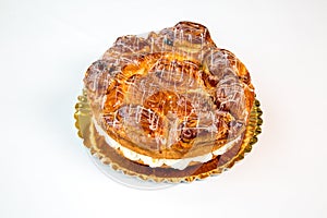 Cake in a gold tray on white background