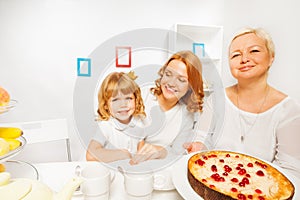 Cake with granny mother and little girl