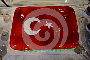 Cake with icing painted Turkish flag, restaurant food concept in the hotel