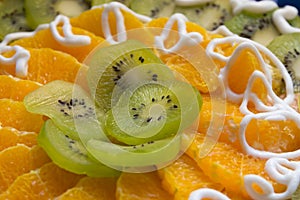 Cake with kiwi and orange slices