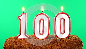 Cake with the number 100 lighted candle. Chroma key. Green Screen. Isolated