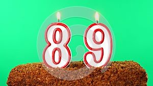 Cake with the number 89 lighted candle. Chroma key. Green Screen. Isolated