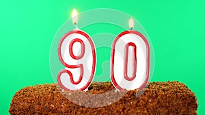 Cake with the number 90 lighted candle. Chroma key. Green Screen. Isolated