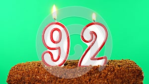 Cake with the number 92 lighted candle. Chroma key. Green Screen. Isolated