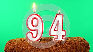 Cake with the number 94 lighted candle. Chroma key. Green Screen. Isolated