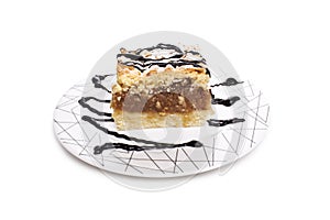 Cake on a plate with chocolate sauce