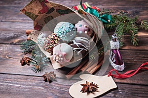 Cake pops. Sweet food. Dark wooden Christmas background. Christmas decorations. Copy space.