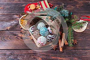 Cake pops. Sweet food. Dark wooden Christmas background. Christmas decorations. Copy space.