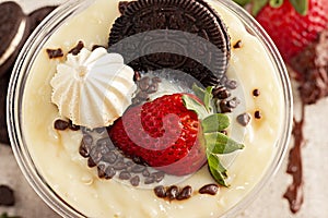 Cake Pot with Strawberry and Meringue on Black Background, Brazilian Copo da Felicidade photo