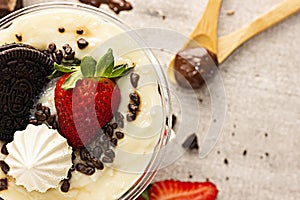 Cake Pot with Strawberry and Meringue on Black Background, Brazilian Copo da Felicidade photo