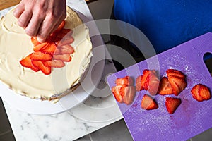 Cake Preparation with Hand Arranging Strawberry Slices