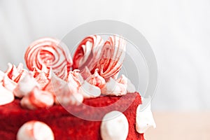 Cake red velvet, chocolate biscuit, white meringue decoration, close-up shot, holiday idea, cafe symbol