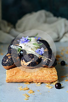 Cake of Saint-onore from puff pastry, profiteroles, currant cream and whipped cream. Classic French dessert. An exquisite confecti photo