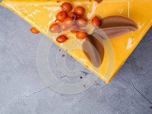 Cake of sea buckthorn yellow color on concrete background