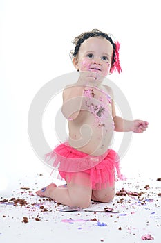 Cake smash shoot: Messy baby girl eating birthday cake!