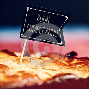 Cake with text buon compleanno, happy birthday in italian photo