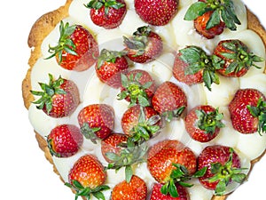 Cake topped with fresh strawberries. Creamy shortbread cake on a white background. Tasty food. Caloric nutrition. Berry cake