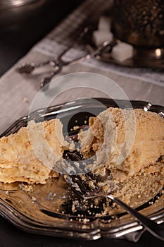 Cake in vintage utensils on a gray background