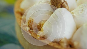 Cake from whipped egg whites, close up background. Birthday white cake with yellow chocolate ganache, marshmallow and