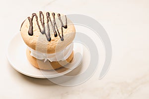 Cake in a white bowl/cake in a white bowl on a white background, copy space