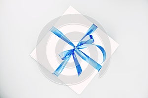 Cake in a white box with ribbon