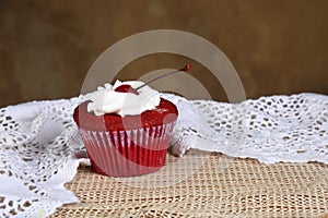 Cakecup red fruit cake with whipped cream with party candy