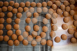 Cakes on automatic conveyor belt or line, process of baking in food factory, top view