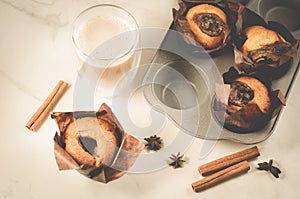 Cakes with a chocolate stuffing and cappuccino/homemade pastries: cakes with a chocolate stuffing and cappuccino glass on a white