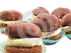 Cakes with cream and chocolate icing