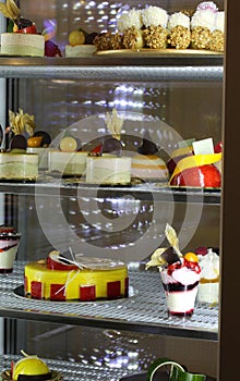 cakes and desserts at the restaurant inside the refrigerator