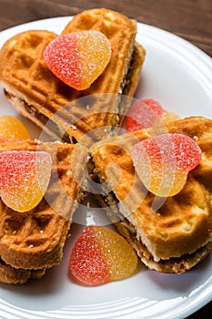 Cakes in the form of hearts are on a white plate.