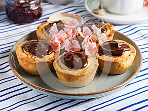 Cakes with frangipane, cherry jam and chocolate