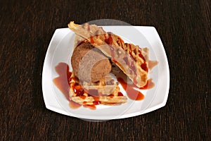 Cakes with fruit jam and chocolate ice cream on white plate