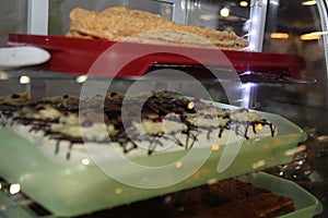 Cakes at local gourmet market stall. Sweets Unhealthy food