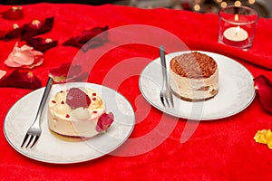 Cakes in white plates on a red tablecloth