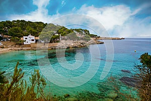 Cala Gat beach in Mallorca with clear blue waters and natural surroundings